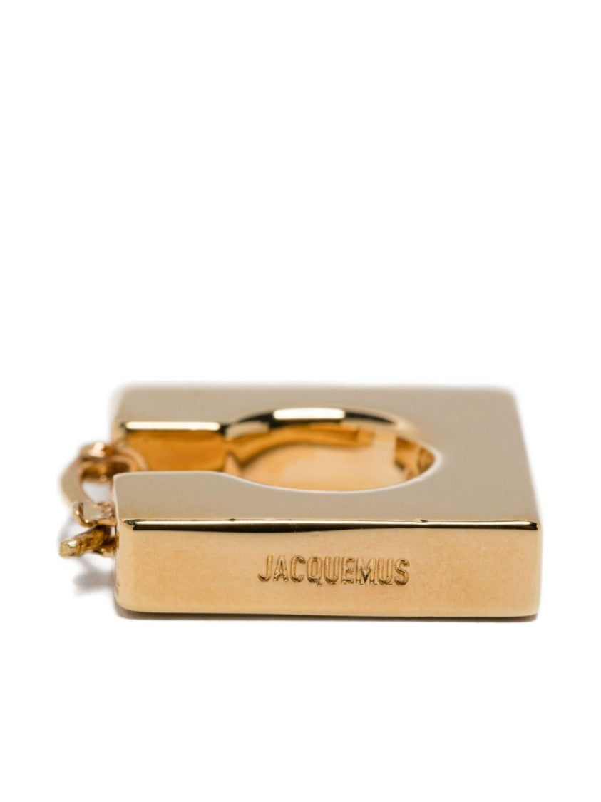 Jacquemus Asymmetrical Hoop Earrings In Polished Brass