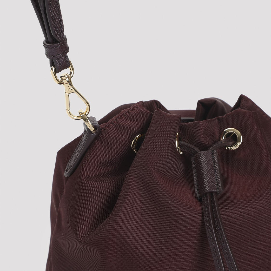 Prada Compact Burgundy Bucket Bag With Drawstring Closure