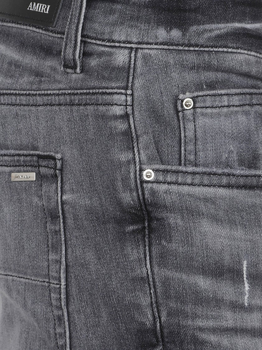 Amiri Distressed Grey Denim Jeans With Ripped Details