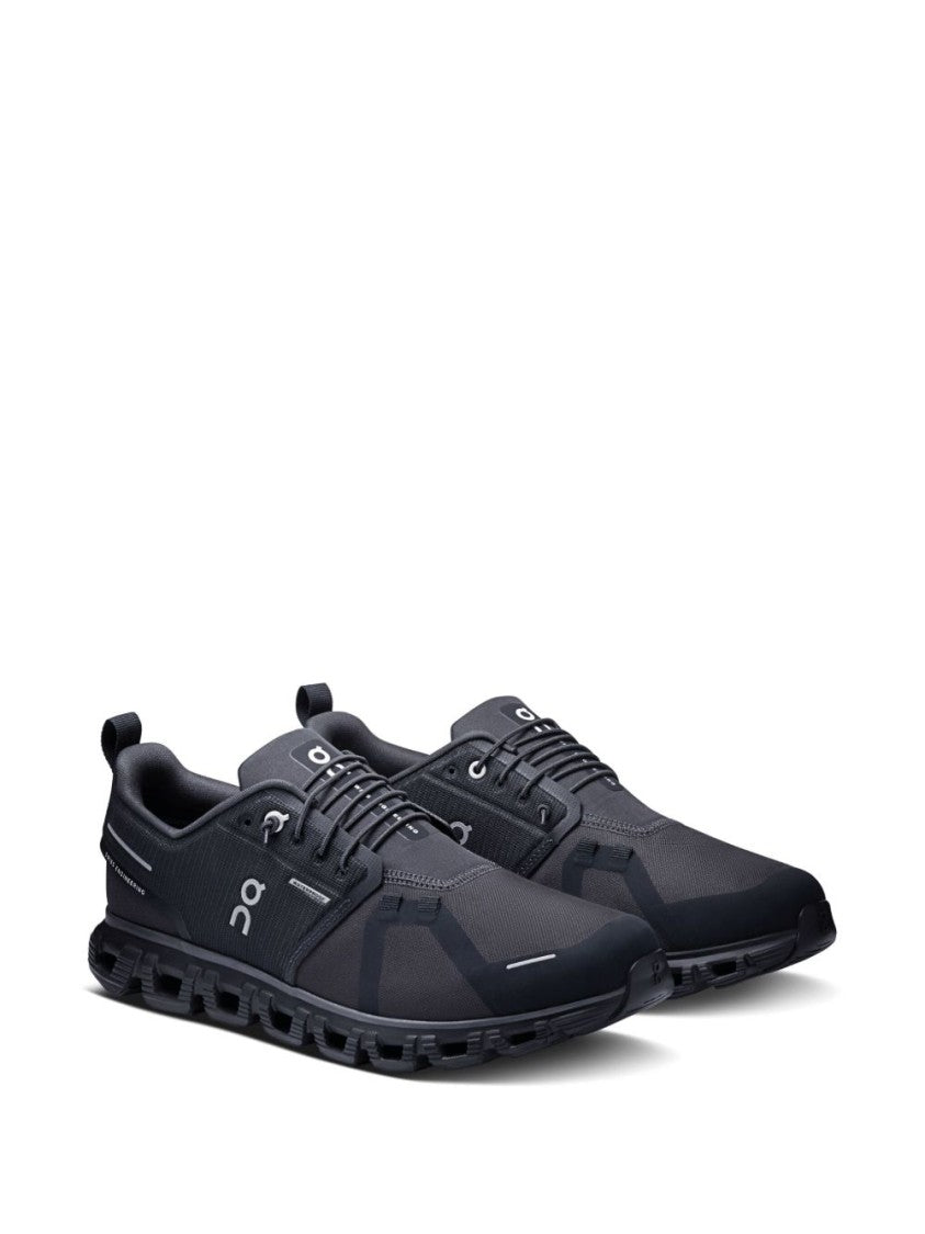 On Low-Profile Black Sneakers With Reflective Accents