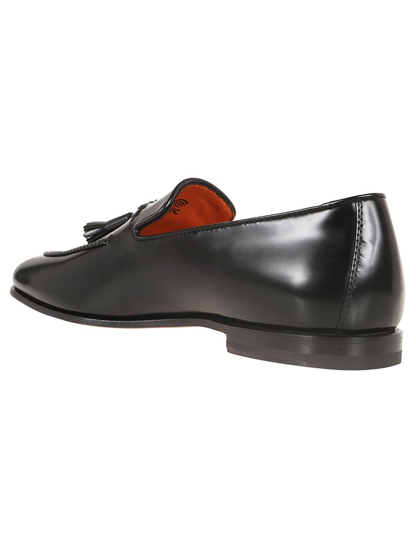 Santoni Black Leather Moccasin With Tapered Toe And Decorative Tassels