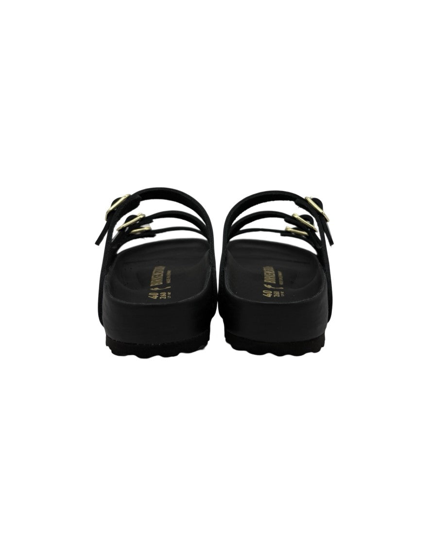 Birkenstock Sleek Black Sandals With Adjustable Straps And Gold Accents