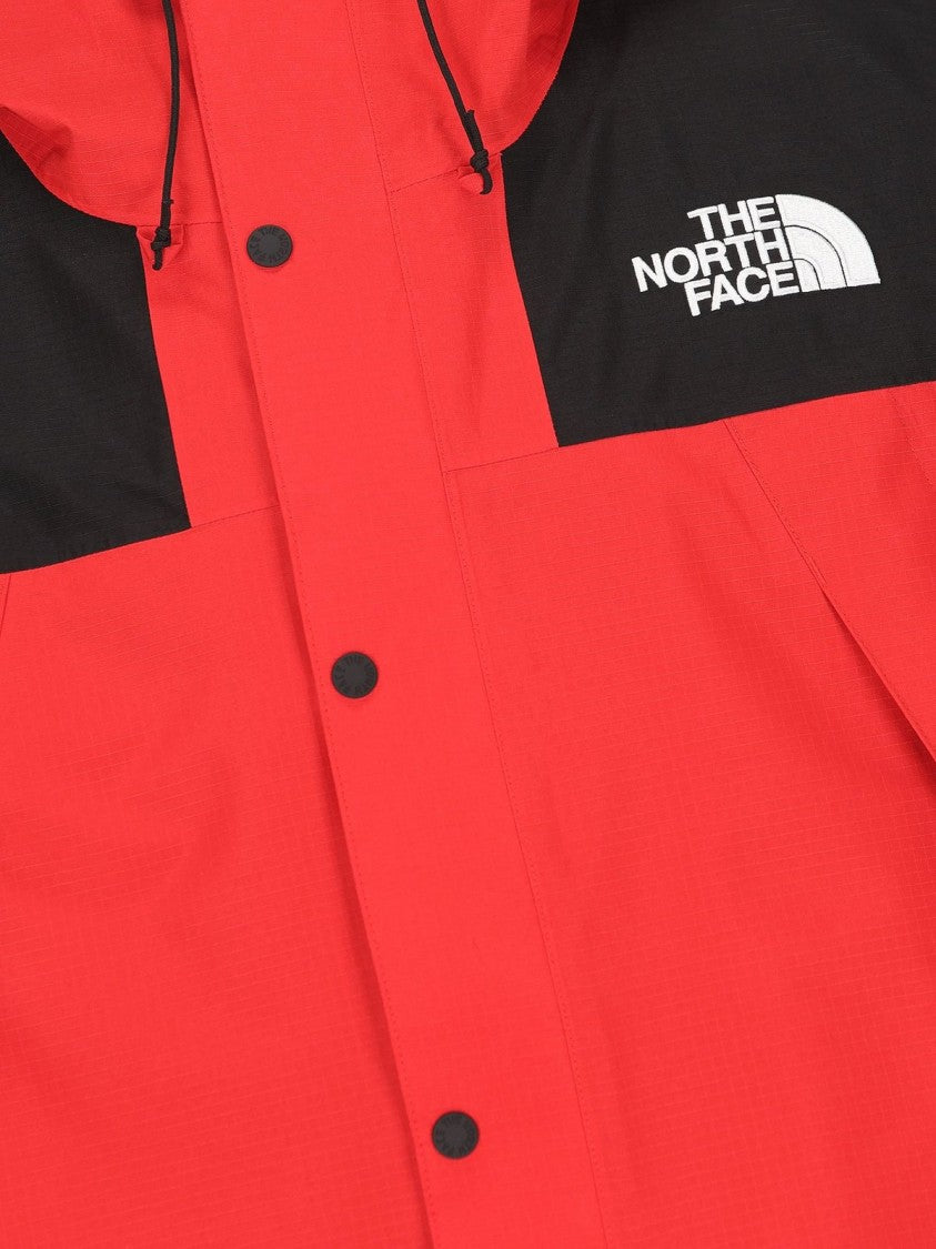 The North Face Classic Red Jacket With High Collar And Practical Fit