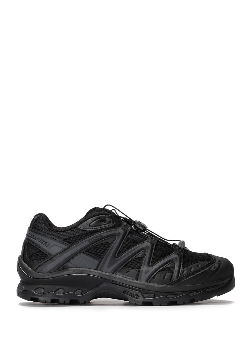 Salomon Streamlined Black Athletic Sneakers With Textured Sole