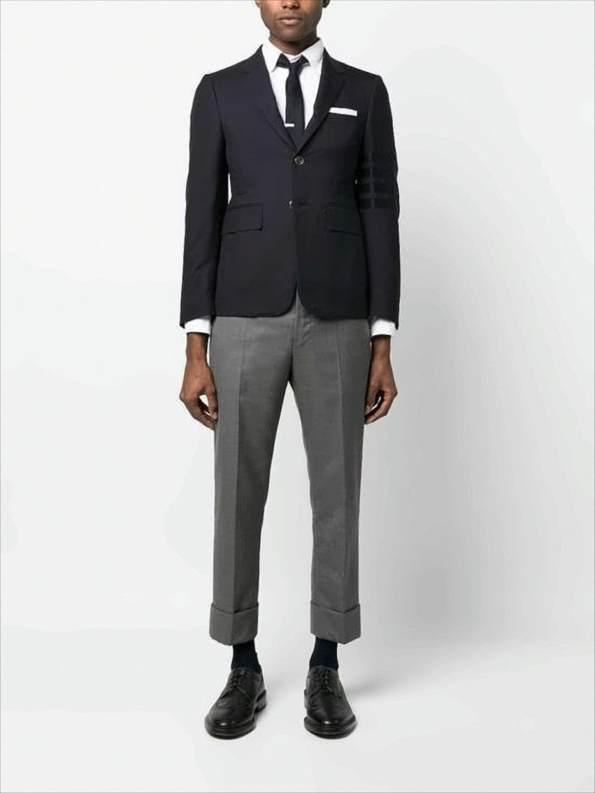 Thom Browne Sleek Tailored Suit Jacket With Notch Lapel And Metallic Buttons