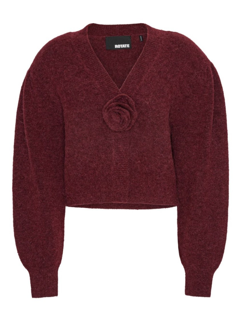 Rotate Cropped Burgundy Sweater With Deep V-Neckline And Floral Embellishment