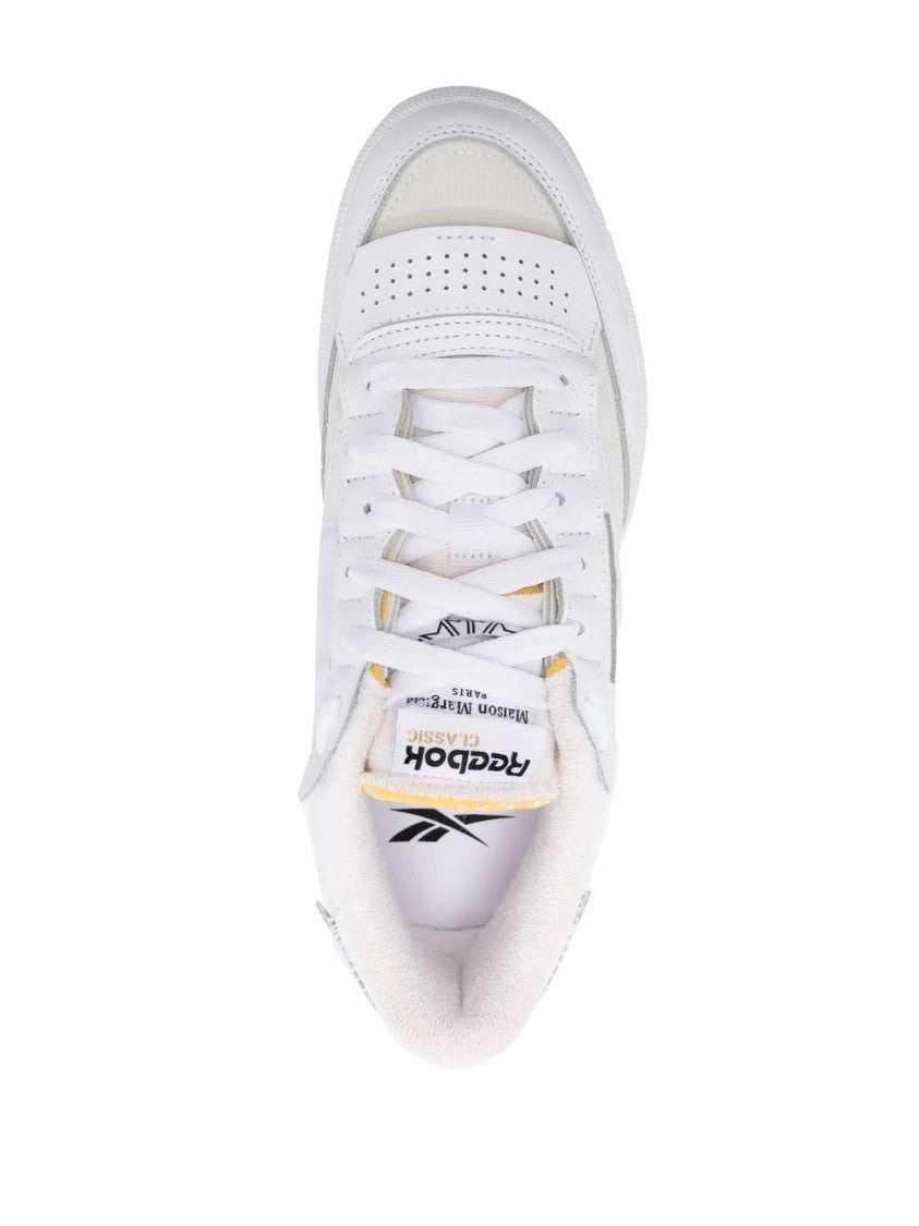Maison Margiela Minimalist White Leather Low-Top Sneakers With Perforated Detailing