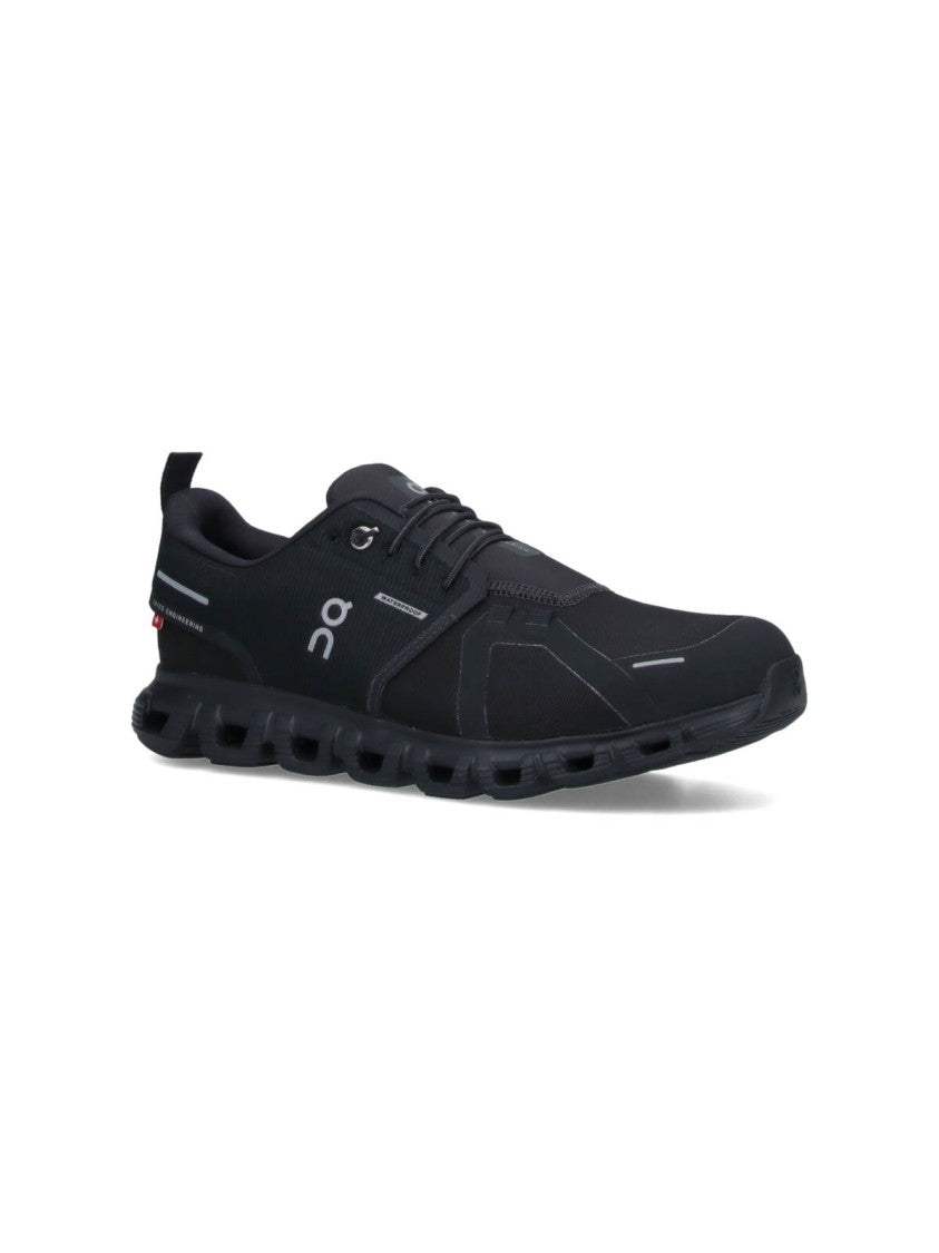 On Low-Profile Sneakers With Segmented Sole And Reflective Accents
