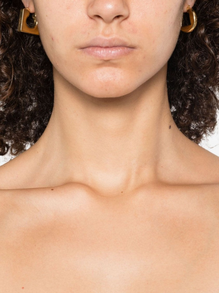 Jacquemus Asymmetrical Hoop Earrings In Polished Brass