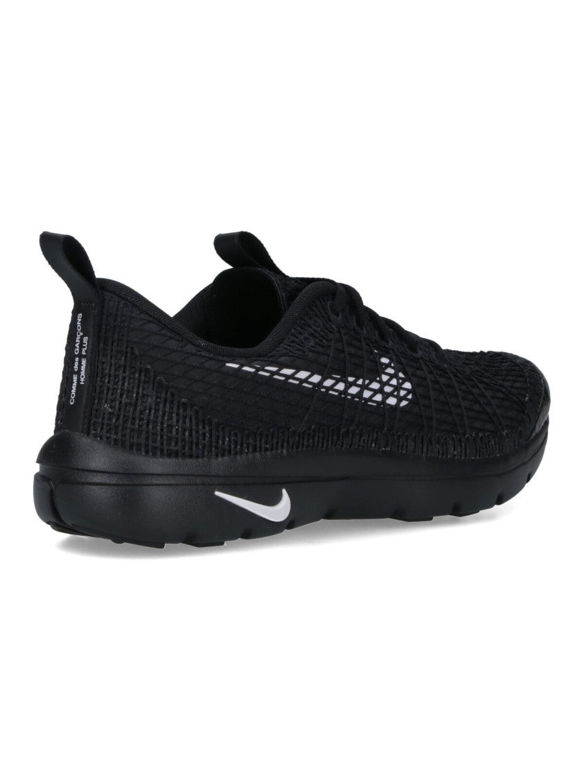 Comme Des Garçons Textured Black Sneakers With Low-Profile Design And Distinctive Branding